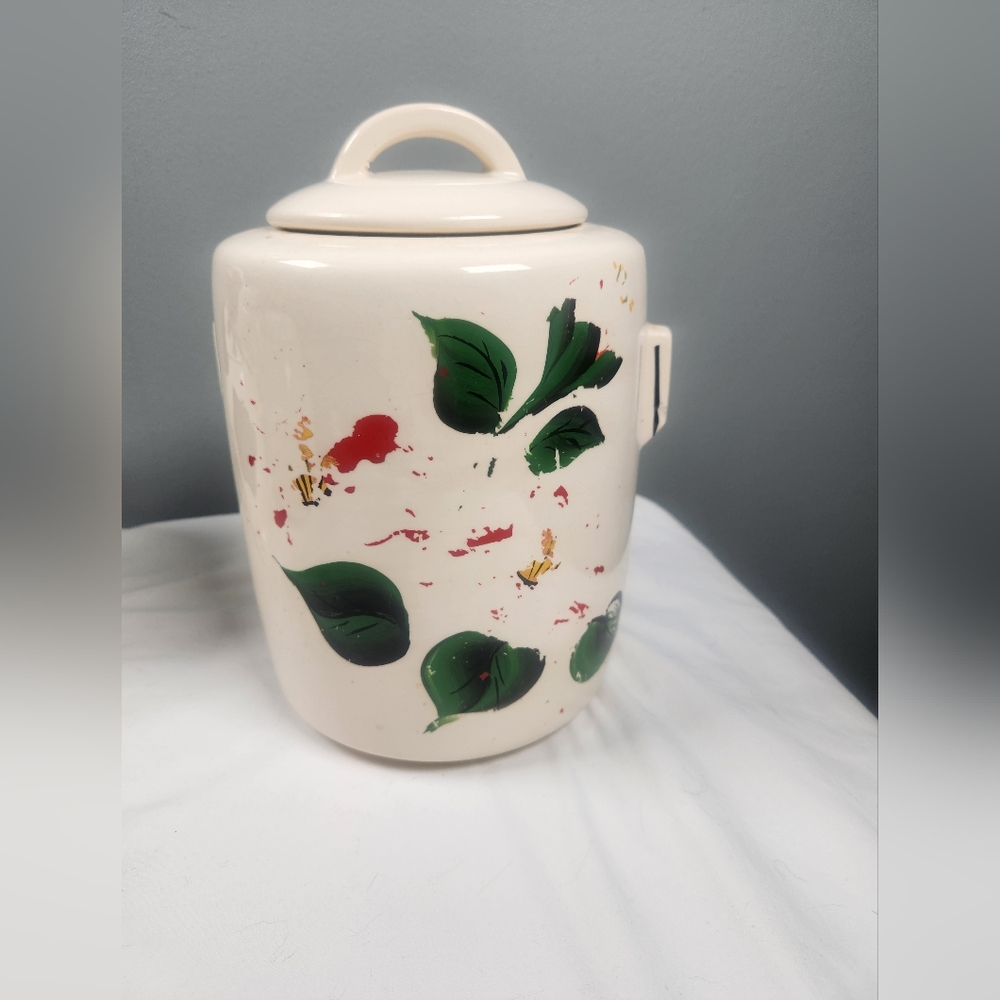 Vintage McCoy 9-10" high cookie jar with non-glazed removable red&green paint.